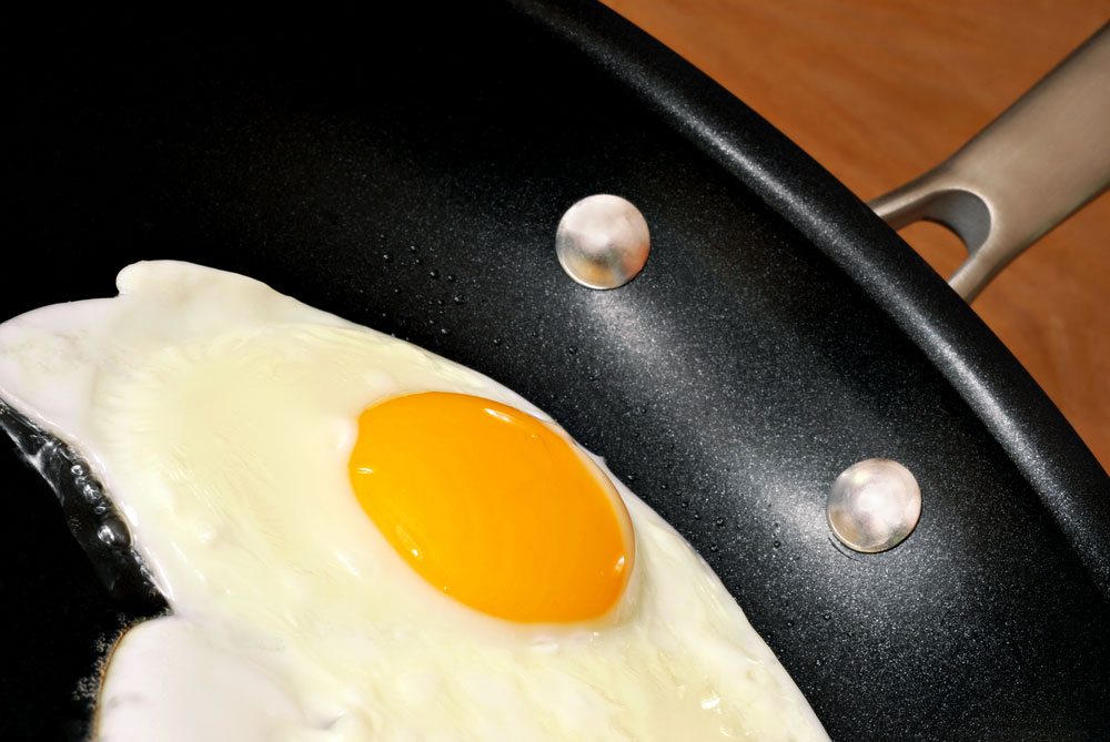 Non-stick pan cooking an egg