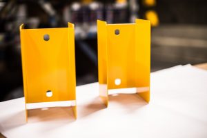 Yellow Powder Coating on Two Metal Parts